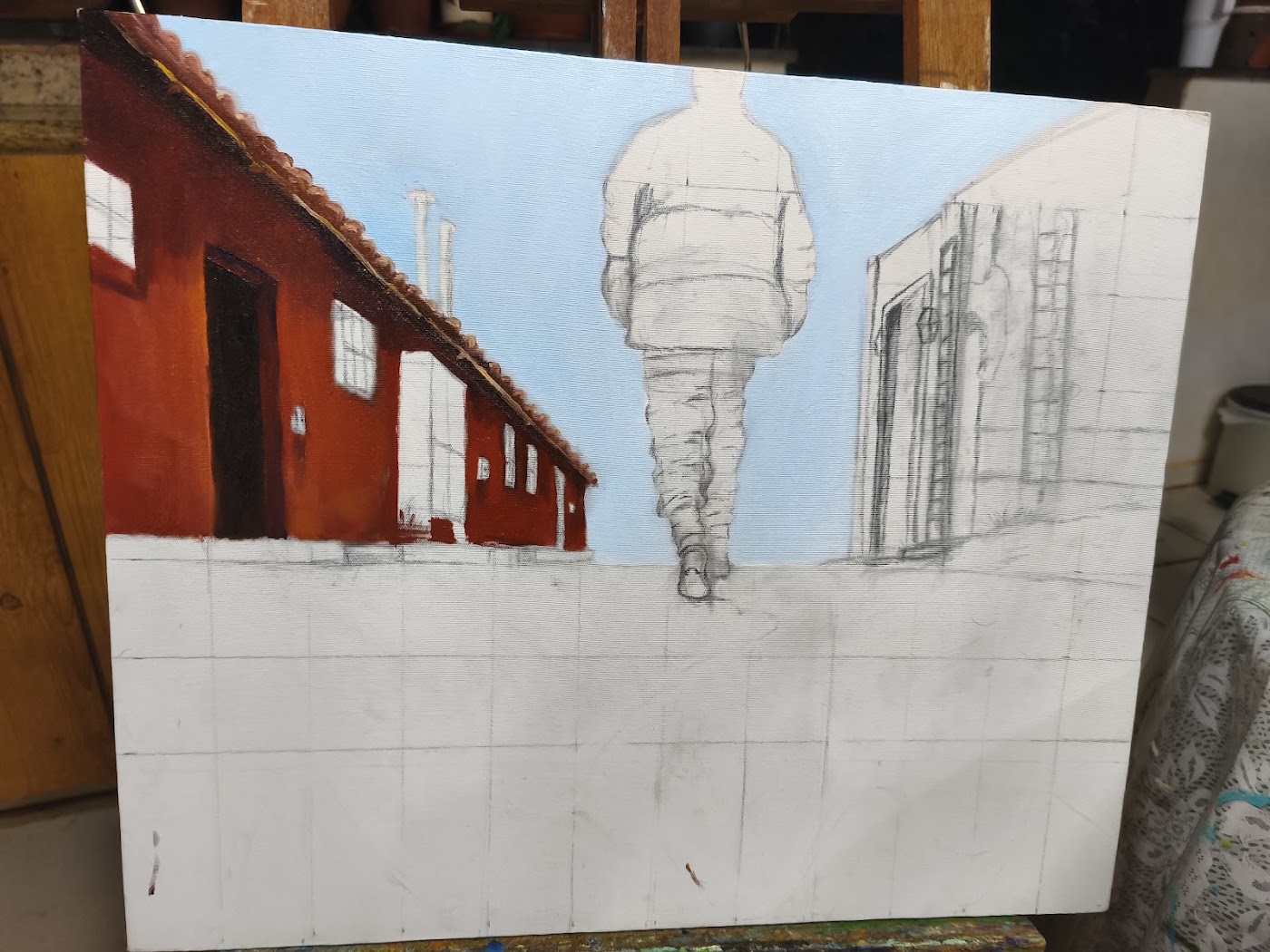 Casa vermelha pintada à esquerda da composição